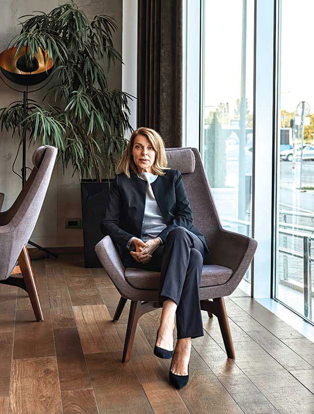 Serious businesswoman sitting in office.